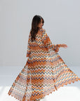 Back view of Amber Chevron long printed outer layer showing flowing silhouette
