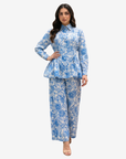 Three-quarter view of the Azure Blossom Pleated Linen Co-ord Set showcasing the pleated floral linen top, wide-leg trousers and premium botanical print.