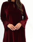 Front detail of Burgundy Velvet Jalabiya featuring a round neckline and flowing long sleeves