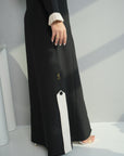 Close-up of Contrast Lapel Abaya highlighting premium abaya fabric, side slit, and contrast panel details by Gharza Couture