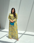 Women's yellow floral linen blend jalabiya with classic collar and elegant modest silhouette