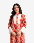 Close-up of the pleated front panel, shirt collar and floral print on the Crimson Blossom linen blend jalabiya