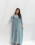 Full-length styled view of dusty blue butter crepe kaftan with front embroidery