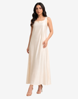 Angled view of the Ivory Grace Crepe Satin Maxi Dress highlighting its relaxed fit and timeless square neckline.