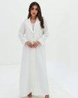 Full-length Ivory White Blazer Textured Stretch Abaya by Gharza Couture with flowing modest silhouette and elegant finish.