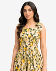 Close-up of the Lemon Blossom Tie Shoulder Linen Blend Dress highlighting the square neckline, tie shoulder straps, and detailed citrus blossom print by Gharza Couture.