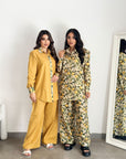 Limoncello Bloom travel wear set featuring a button-down top and wide-leg trousers.
