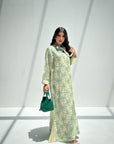 Full-length Palm Canopy Bow Neck Jalabiya with teal palm print, pleated hem and flowing modest silhouette