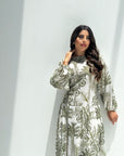 Close-up detail of botanical print linen blend fabric on luxury women's jalabiya