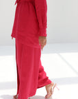 Close-up of the wide-leg linen blend trousers from the Ruby Essence Linen Blend Co-ord Set in ruby red.
