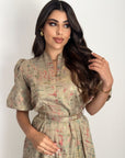 Close-up view of the neckline detail on the Abstract Print Belted Dress.