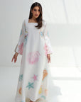 Full-length view of Seashell Embellished Linen Blend Jalabiya with white base and colorful seashell print