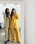 imoncello Bloom travel wear set featuring a button-down top and wide-leg trousers.