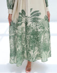Green leaf-patterned dress on a white background