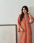 Zahara Sunset Jalabiya in vibrant orange geometric print