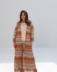 Full-length Amber Chevron Set styled with printed outer layer and wide-leg trousers