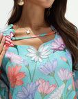 Close-up view of Azure Blossom jalabiya showing the floral print and neckline embellishment