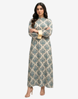 Full-length cotton chiffon dress with a classic blue heritage pattern, high neckline, long sleeves, and contrast cuffs.