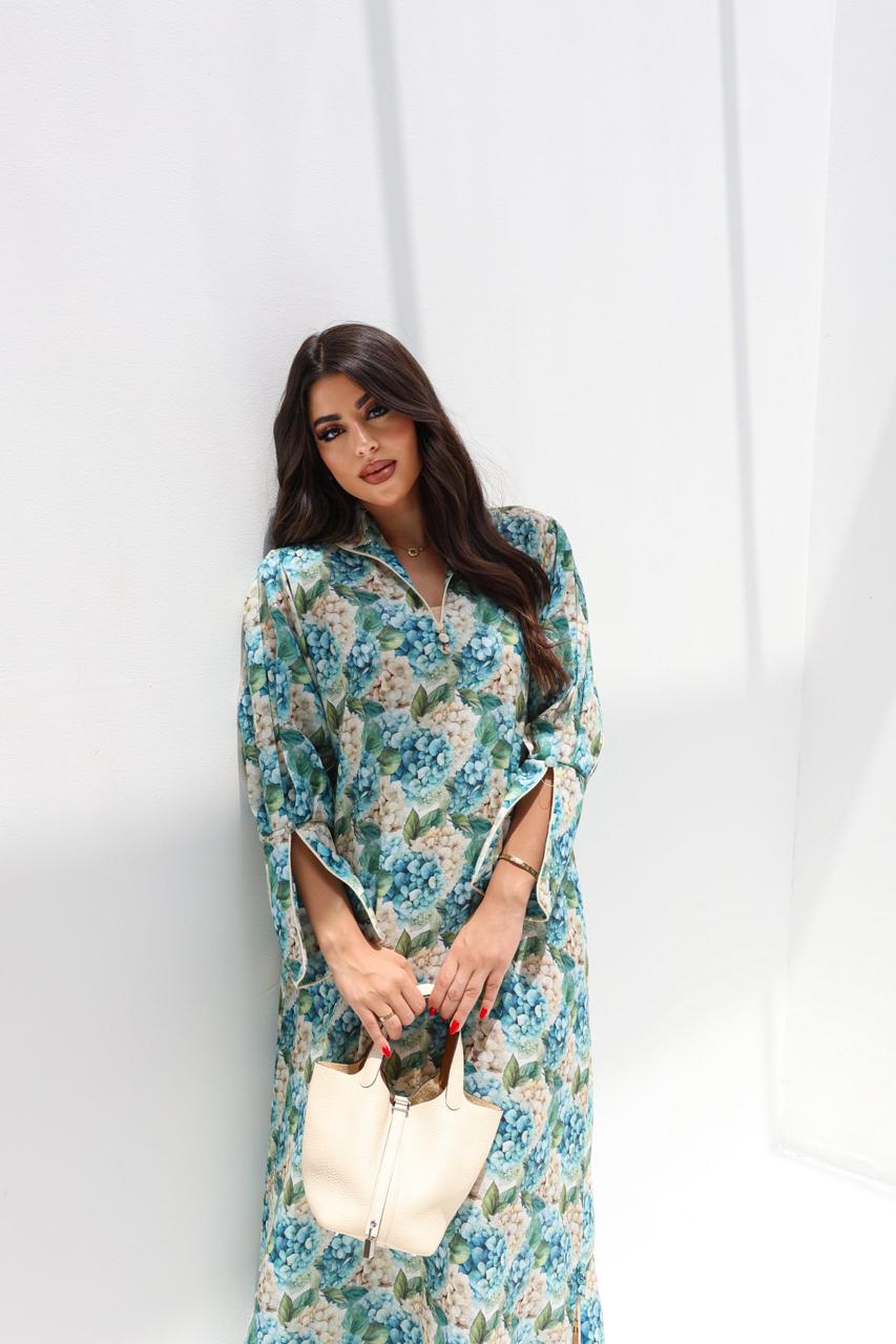 Woman wearing a floral dress against a white background