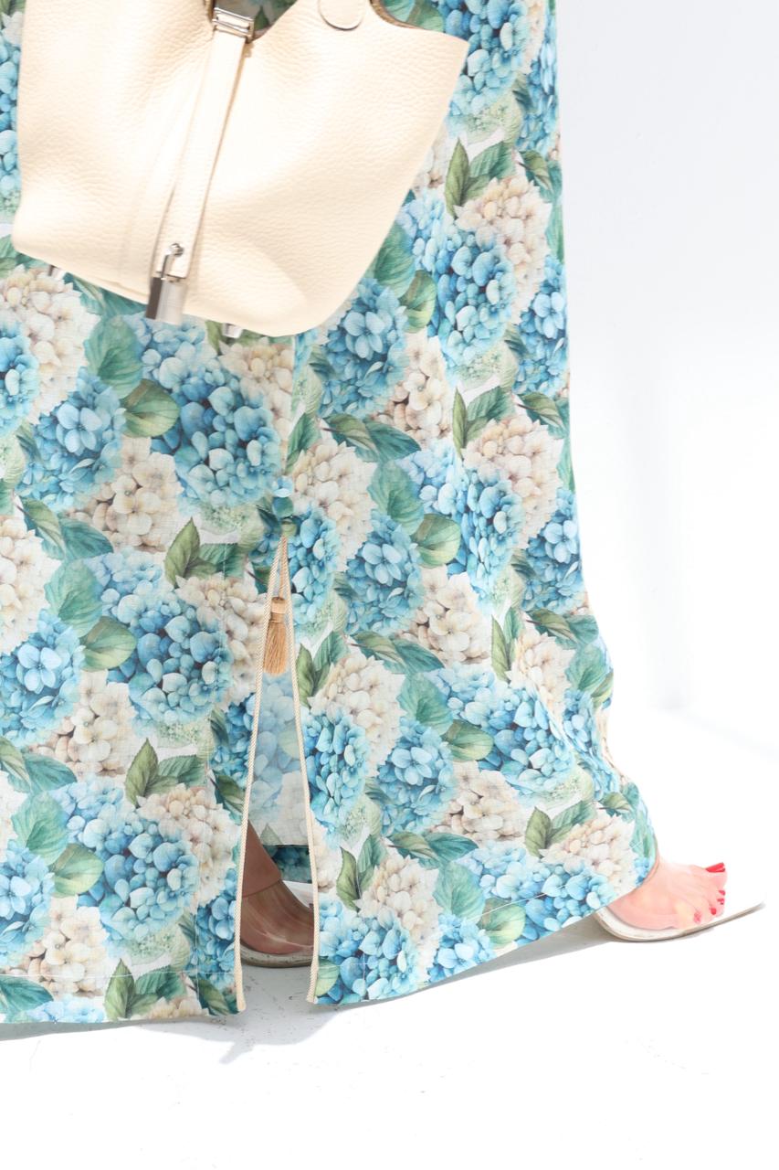 Floral dress with blue and green flowers on a white background