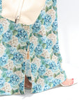 Floral dress with blue and green flowers on a white background
