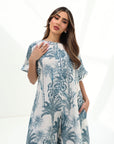 Portrait of the Blue Tropique Linen Blend Jumpsuit by Gharza Couture featuring elegant tropical artwork, relaxed silhouette and premium linen blend fabric.