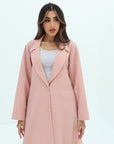 Close-up of the Blush Pink Blazer Textured Stretch Abaya by Gharza Couture highlighting the textured fabric and refined tailoring.