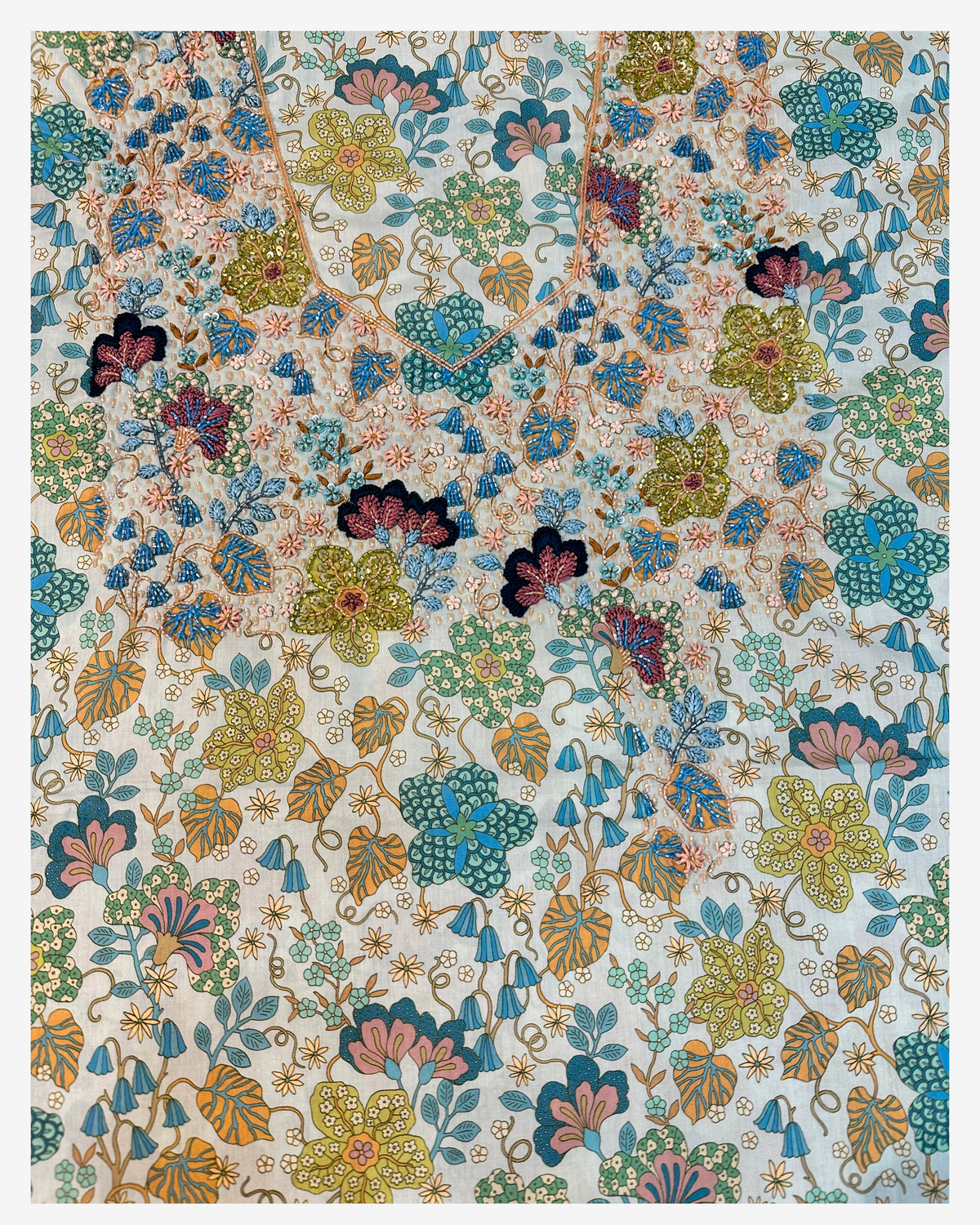 Complete botanical Liberty mukhawar fabric with a hand-beaded floral neckline in blue, sage, blush and navy.