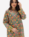 A woman modeling a long-sleeve green kurta with a vibrant multicolor floral print and yellow-gold trim on the cuffs, set against a plain light gray background.
