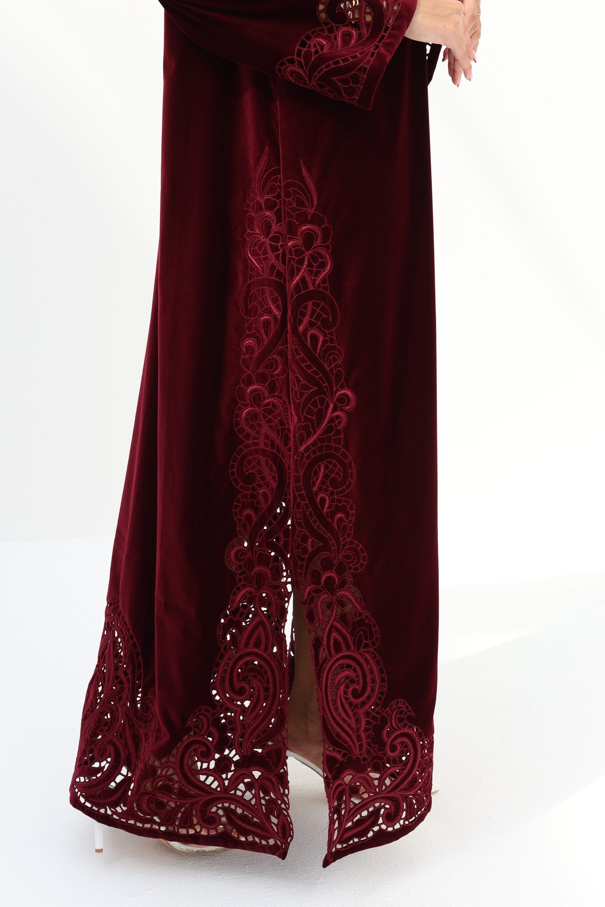 Side slit and embroidered hem detail of Burgundy Velvet Embroidered Jalabiya