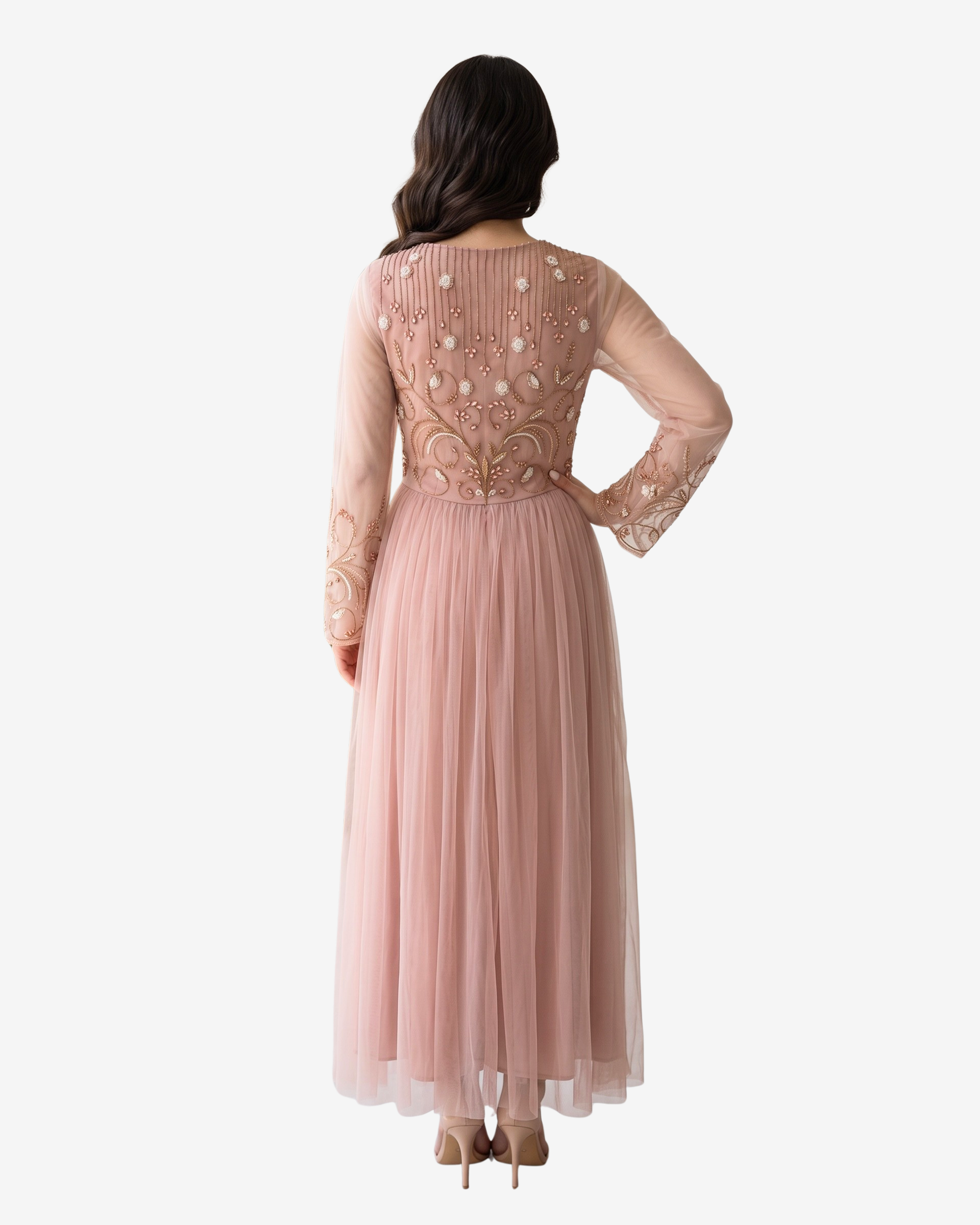 Back view of the Celestial Bloom blush pink tulle evening dress featuring a full-length flowing silhouette and sheer long sleeves.