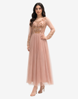 Side view of the Celestial Bloom blush pink hand embellished tulle evening dress with graceful pleated skirt by Gharza Couture.