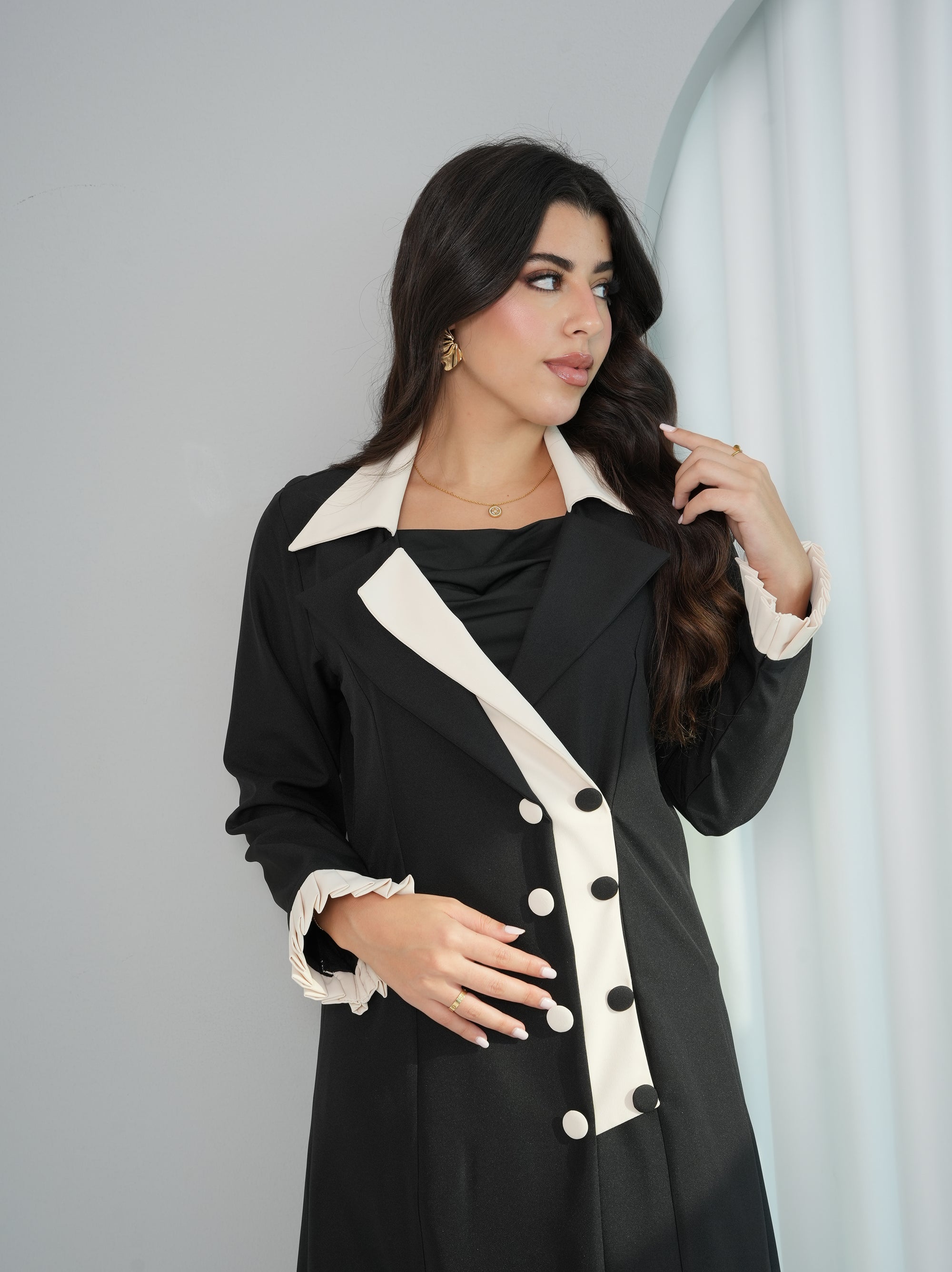 Half-body view of Contrast Lapel Abaya showcasing contrast lapels and decorative button details by Gharza Couture