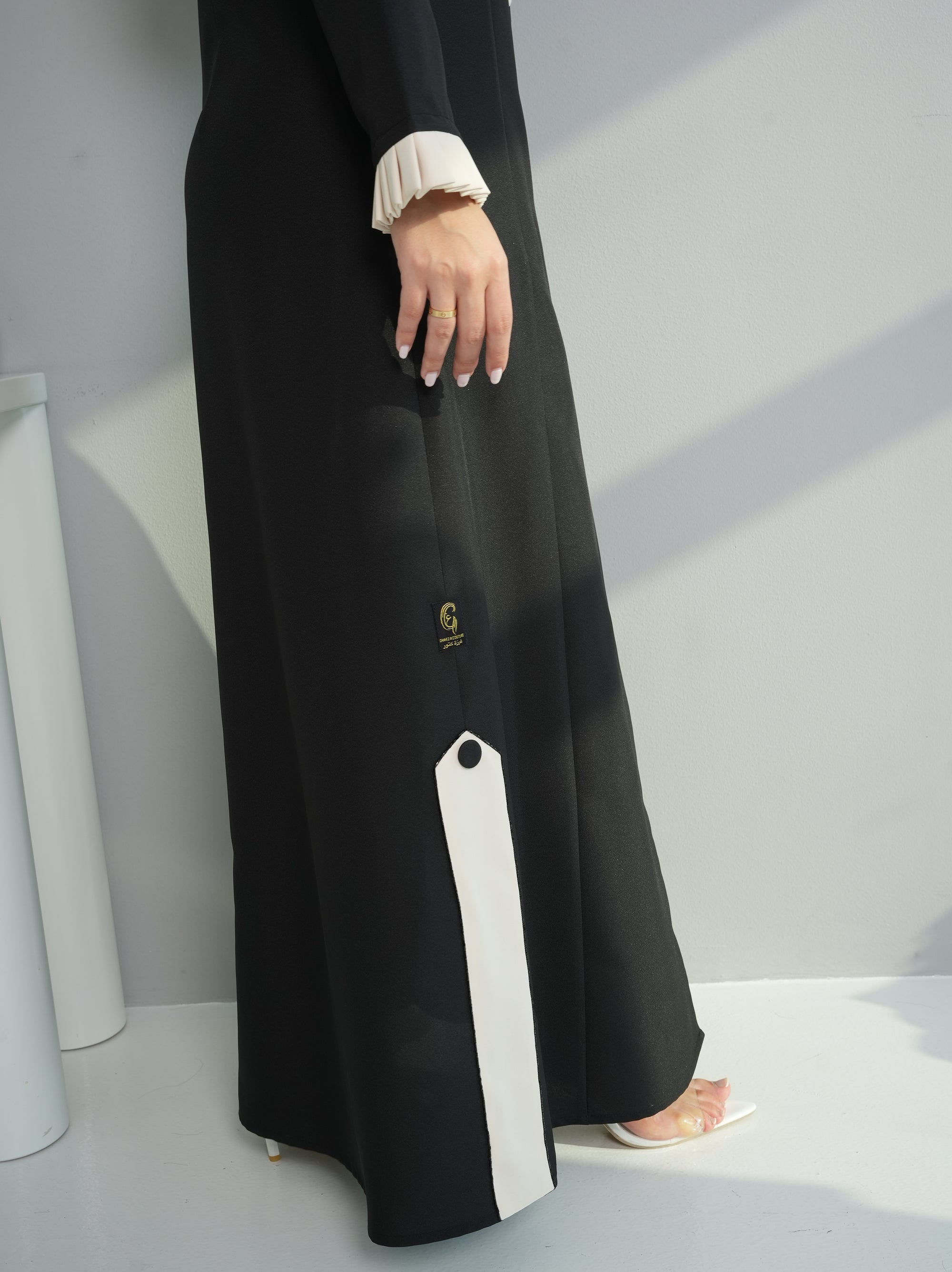 Close-up of Contrast Lapel Abaya highlighting premium abaya fabric, side slit, and contrast panel details by Gharza Couture