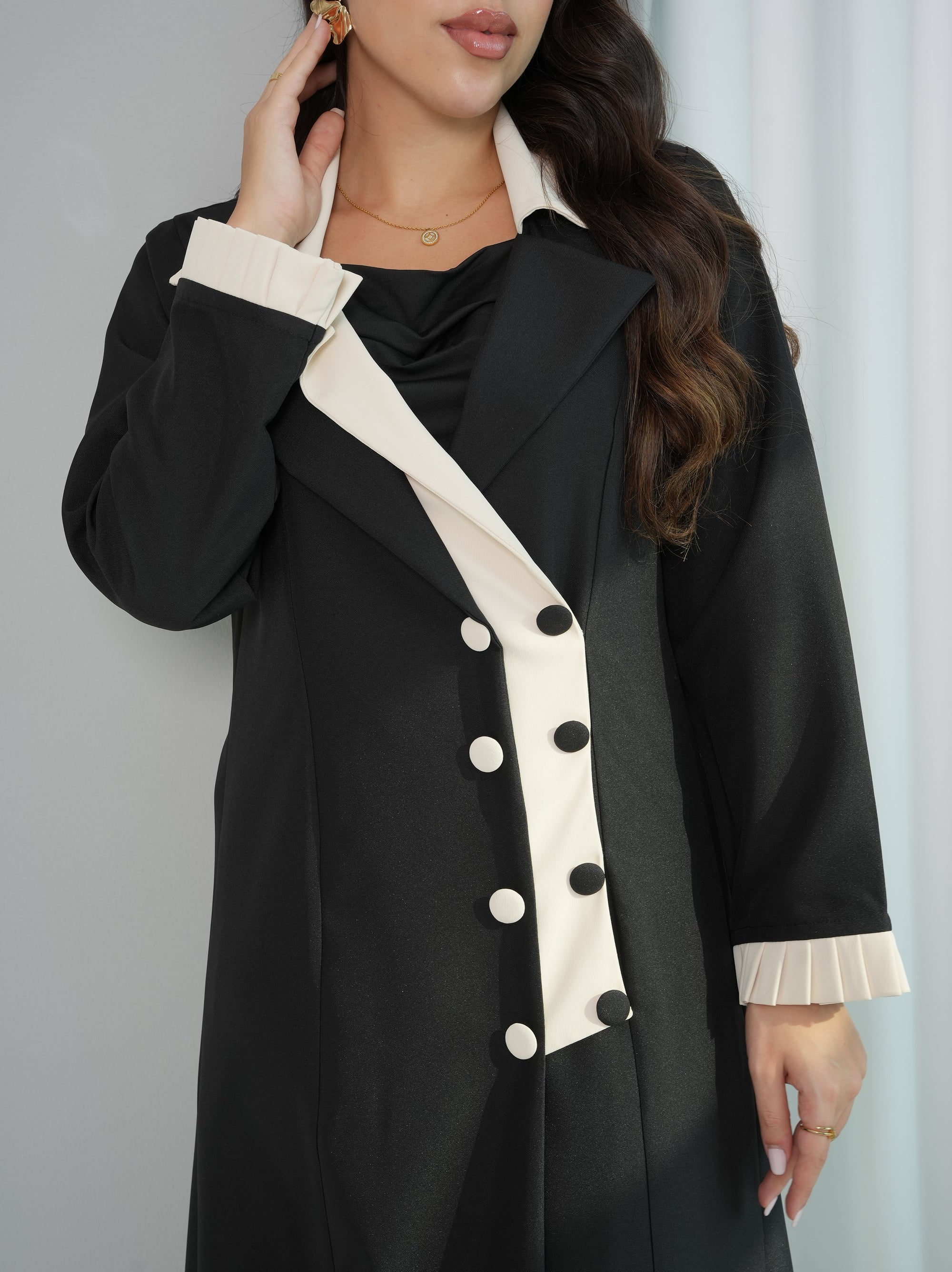 Close-up of Contrast Lapel Suit Abaya highlighting the asymmetric ivory lapel and double-breasted buttons