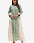 A woman modeling a long-sleeved green printed kurta with beige side panels and a matching beige dupatta, set against a plain light gray background.