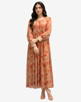 Close-up of the Coral Bloom Pleated Cotton Chiffon Dress highlighting the pleated bodice, decorative buttons, floral print, and chiffon fabric.