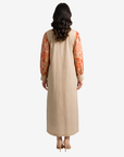 Back view of the Coral Bloom Pleated Cotton Chiffon Dress showcasing the contrasting cotton back panel and lightweight chiffon sleeves.