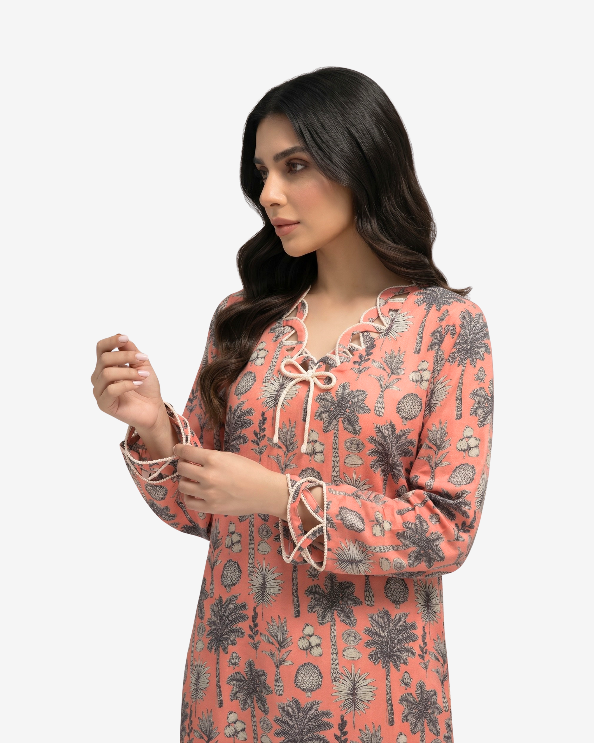 Close-up of the rope trim neckline, front bow and sleeve detail on the Coral Oasis linen blend jalabiya
