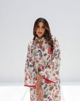 Three-quarter portrait of Coral Reef Embellished Jalabiya showing the flowing sleeves and printed design