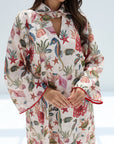 Front detail of embellished coral reef print jalabiya with a softly gathered high neckline
