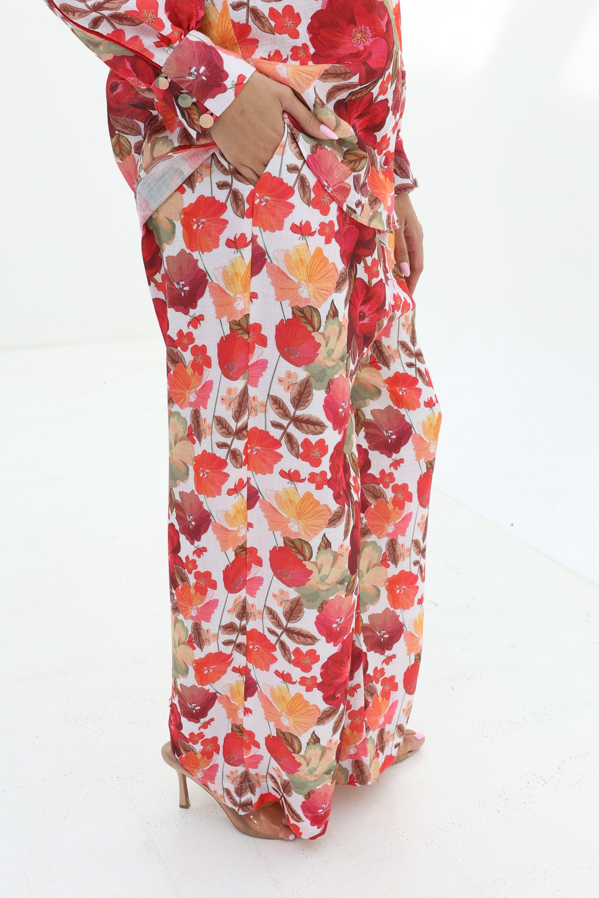 Close-up of the Crimson Bloom Linen Blend Co-Ord Set featuring lined wide-leg trousers with a vibrant floral print.