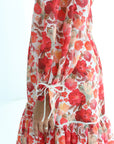Close-up of Crimson Bloom Linen Blend Dress showing floral print and tiered hem