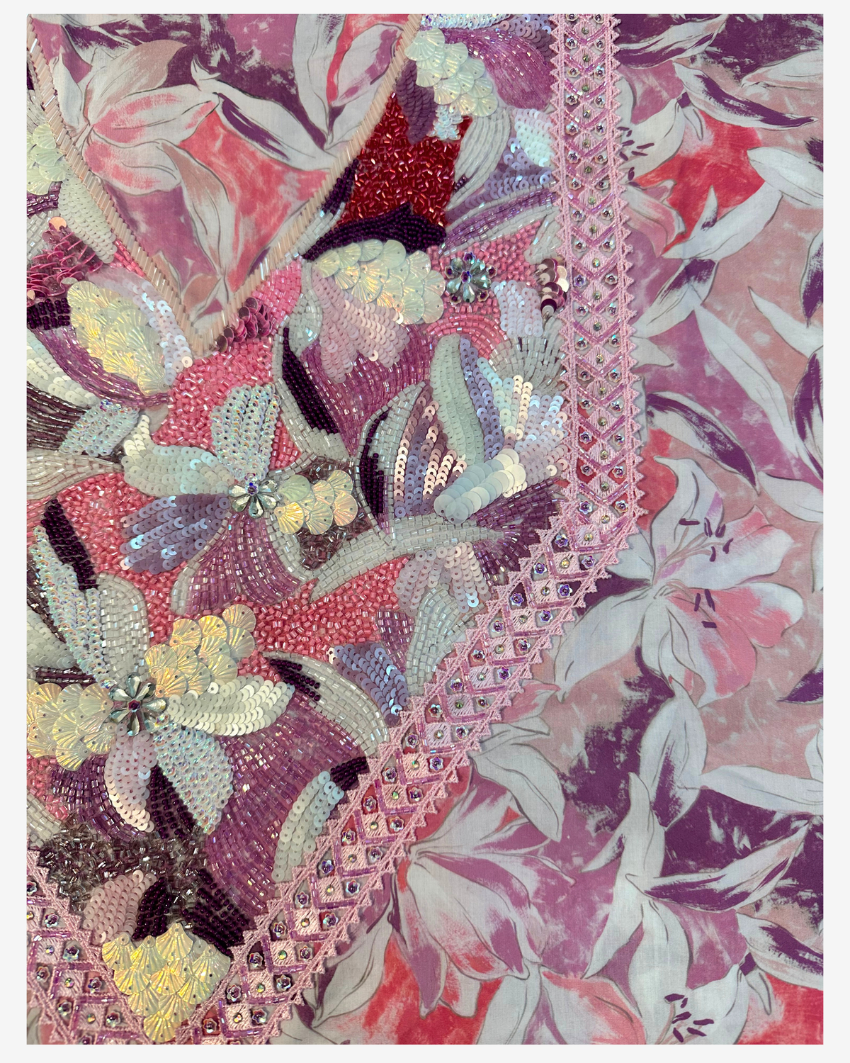 Close-up of the layered sequin and bead embellishment with pink crystal-trimmed lace on Italian Liberty fabric.