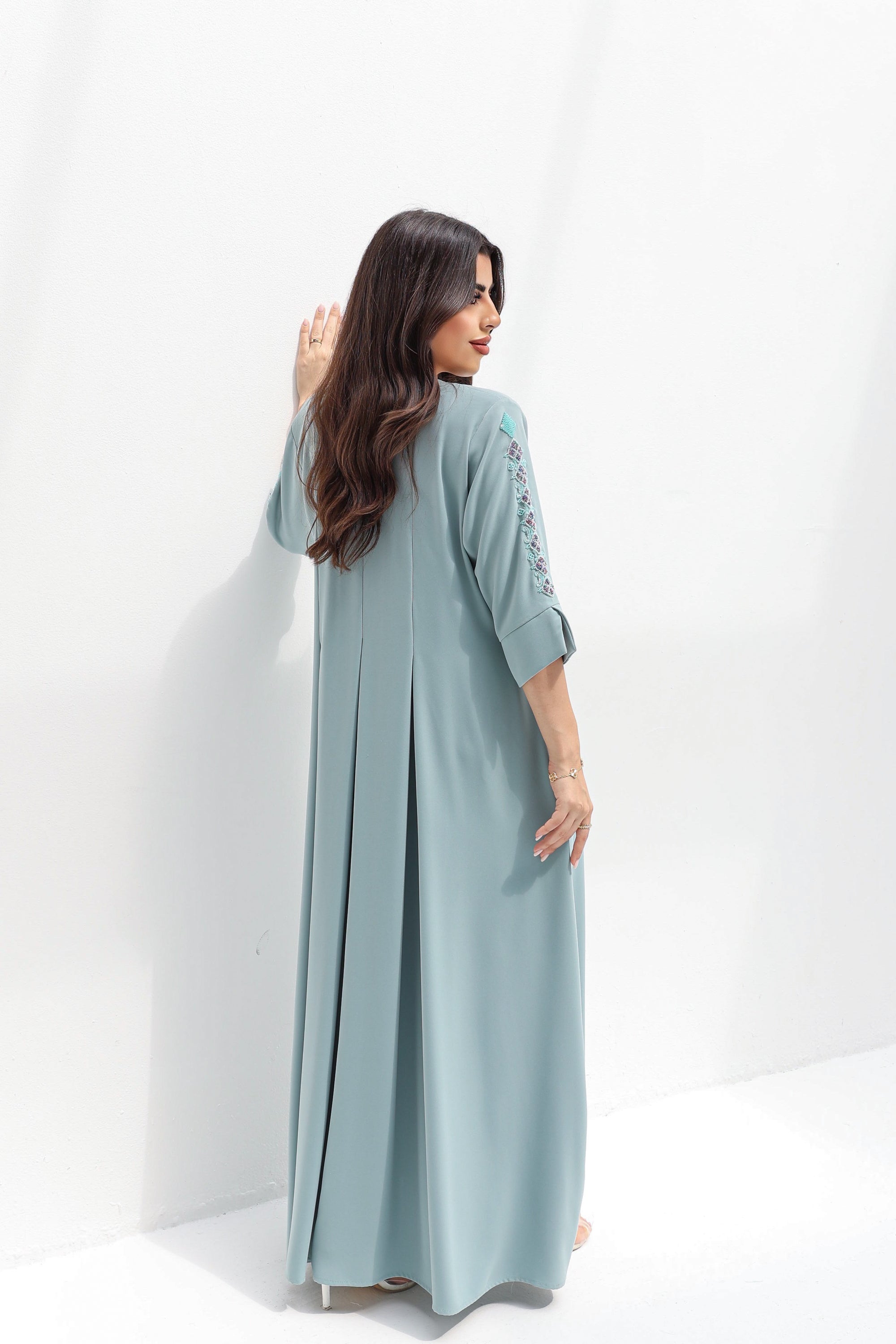  Three-quarter back view of Embroidered Butter Crepe Kaftan showing its full-length drape
