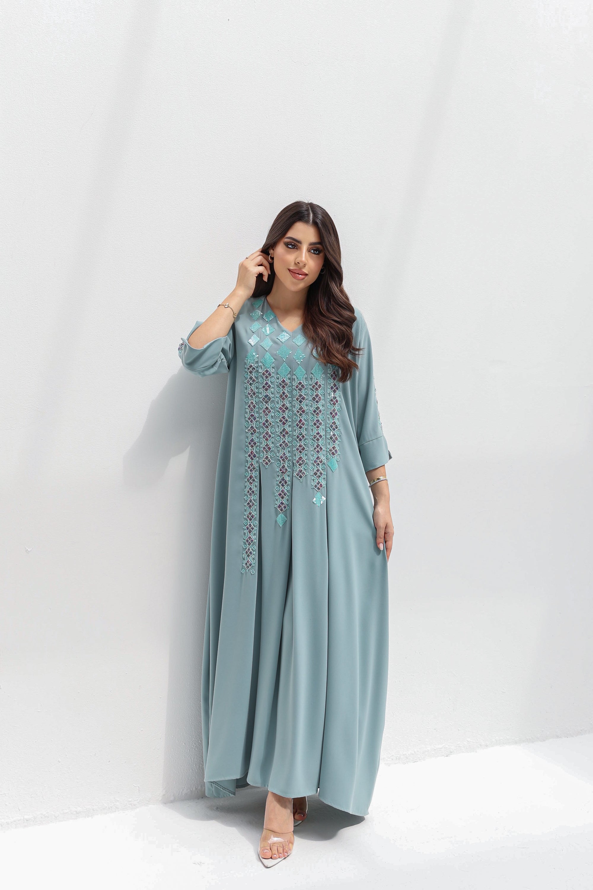 Full-length styled view of dusty blue butter crepe kaftan with front embroidery
