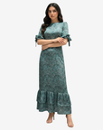 Luxury linen blend modest dress with an emerald paisley print, ruffle sleeves, and a graceful full-length design.