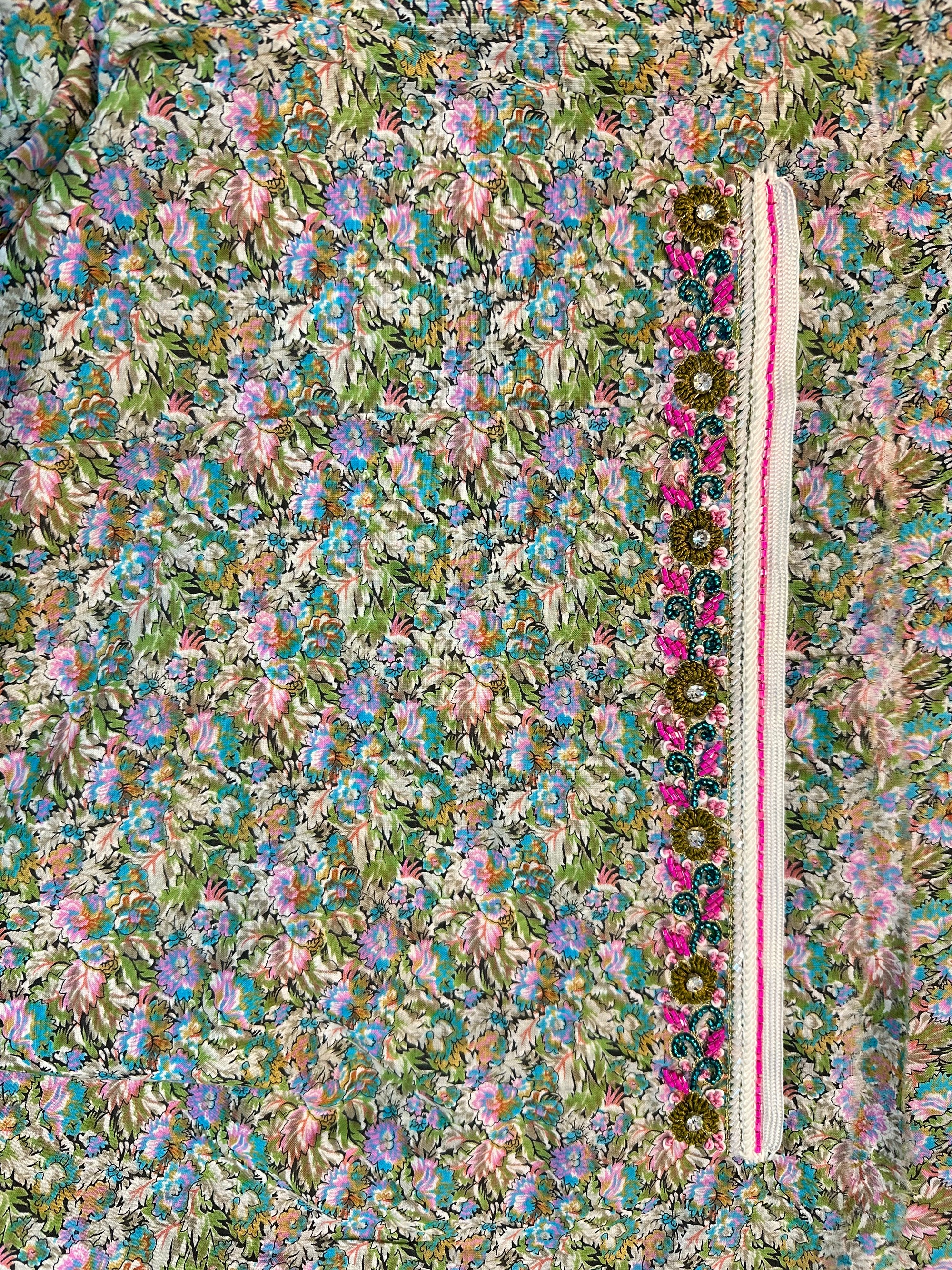 Detailed view of Floral Cotton Mukhawar highlighting the colourful floral print on premium unstitched cotton fabric for custom tailoring by Gharza Couture.