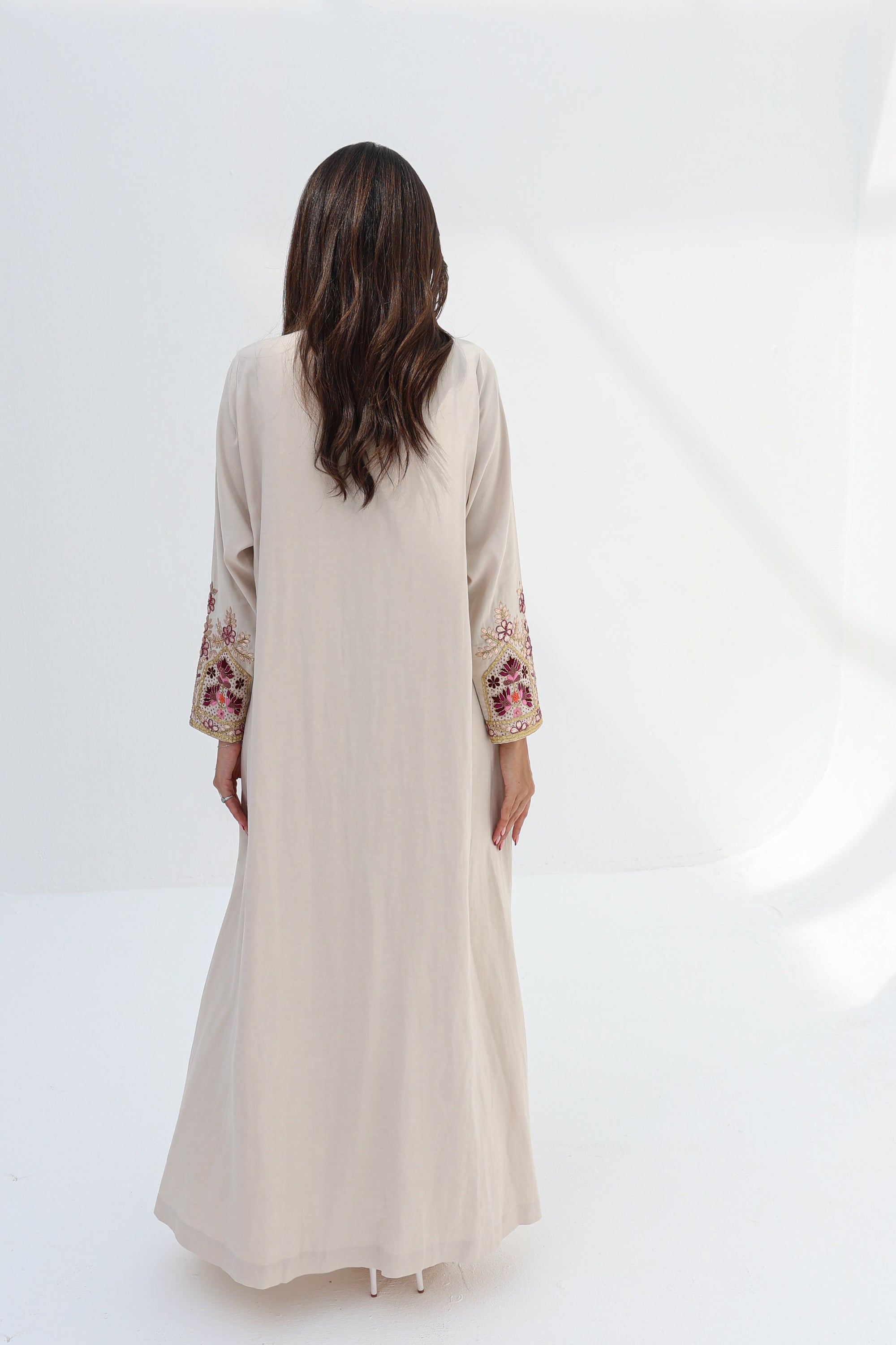 Back view of ivory Floral Embroidered Trim Abaya with full-length silhouette