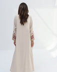Back view of ivory Floral Embroidered Trim Abaya with full-length silhouette